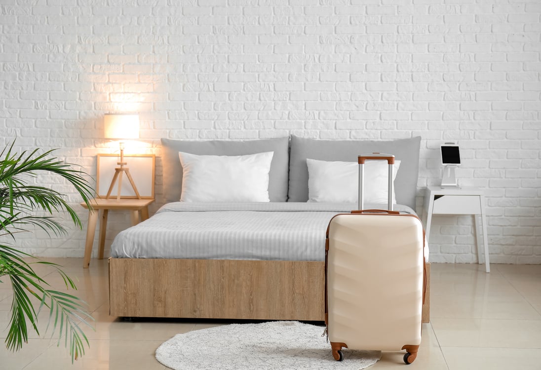 Suitcase in Modern Hotel Room